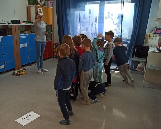 Children learn English during a Moomin Language School playful lesson.