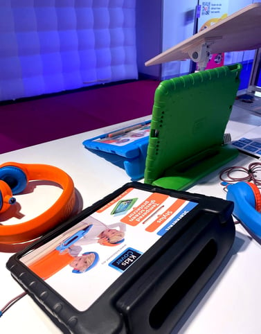 Tablet covers and headphones on a table