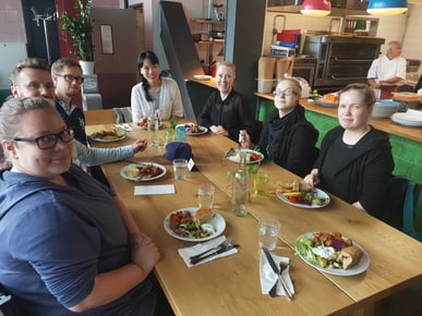 Moomin Language School team around a dinner table