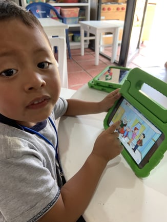 A boy using MoominLS in Guatemala