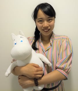 Wako holding a Moomin toy