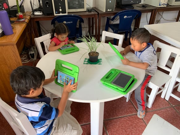 Children using MoominLS in Guatemala