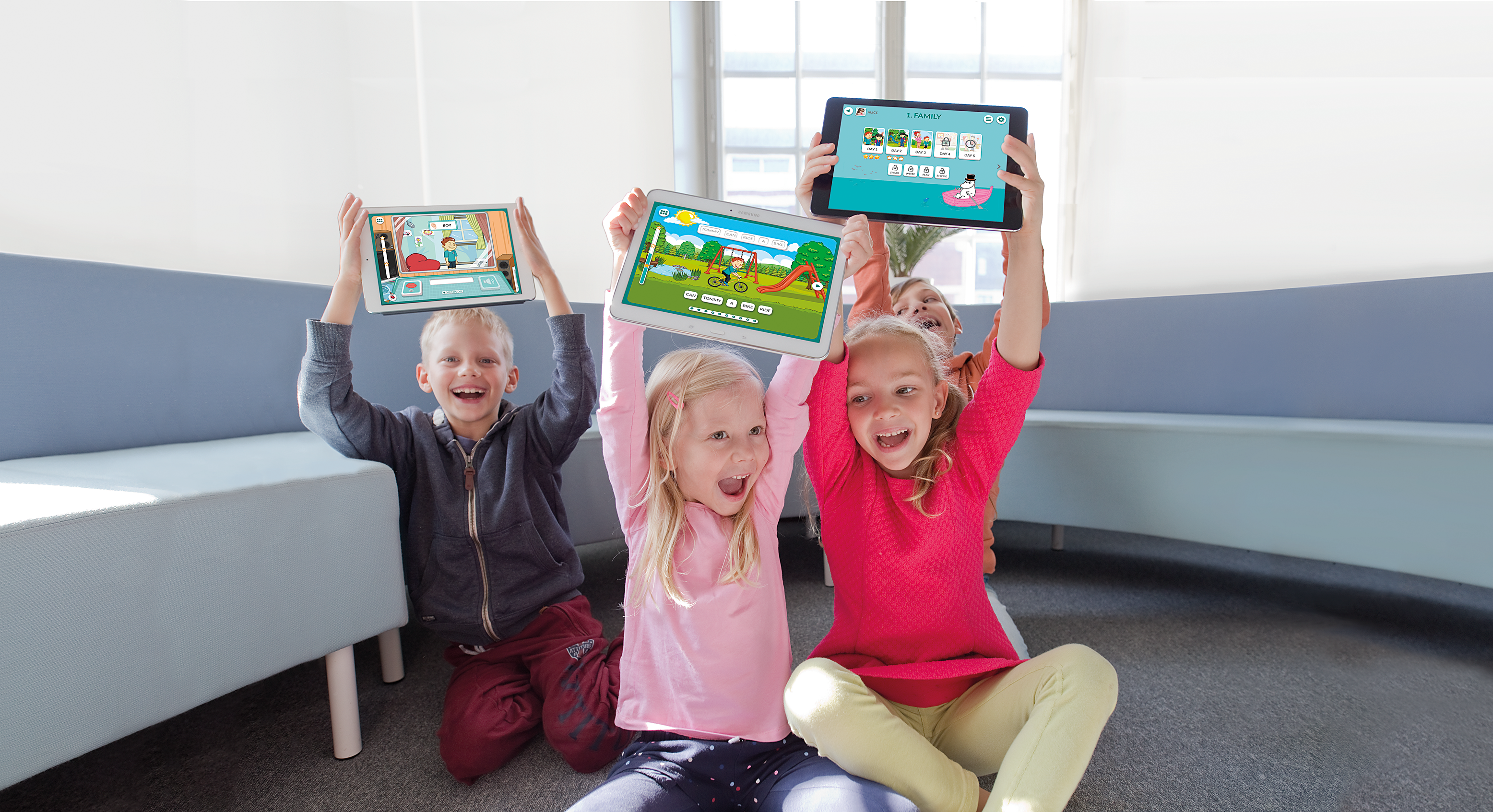 Happy children holding tablets